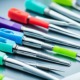 A collection of colorful dental tools and equipment used for applying sealants onto teeth.